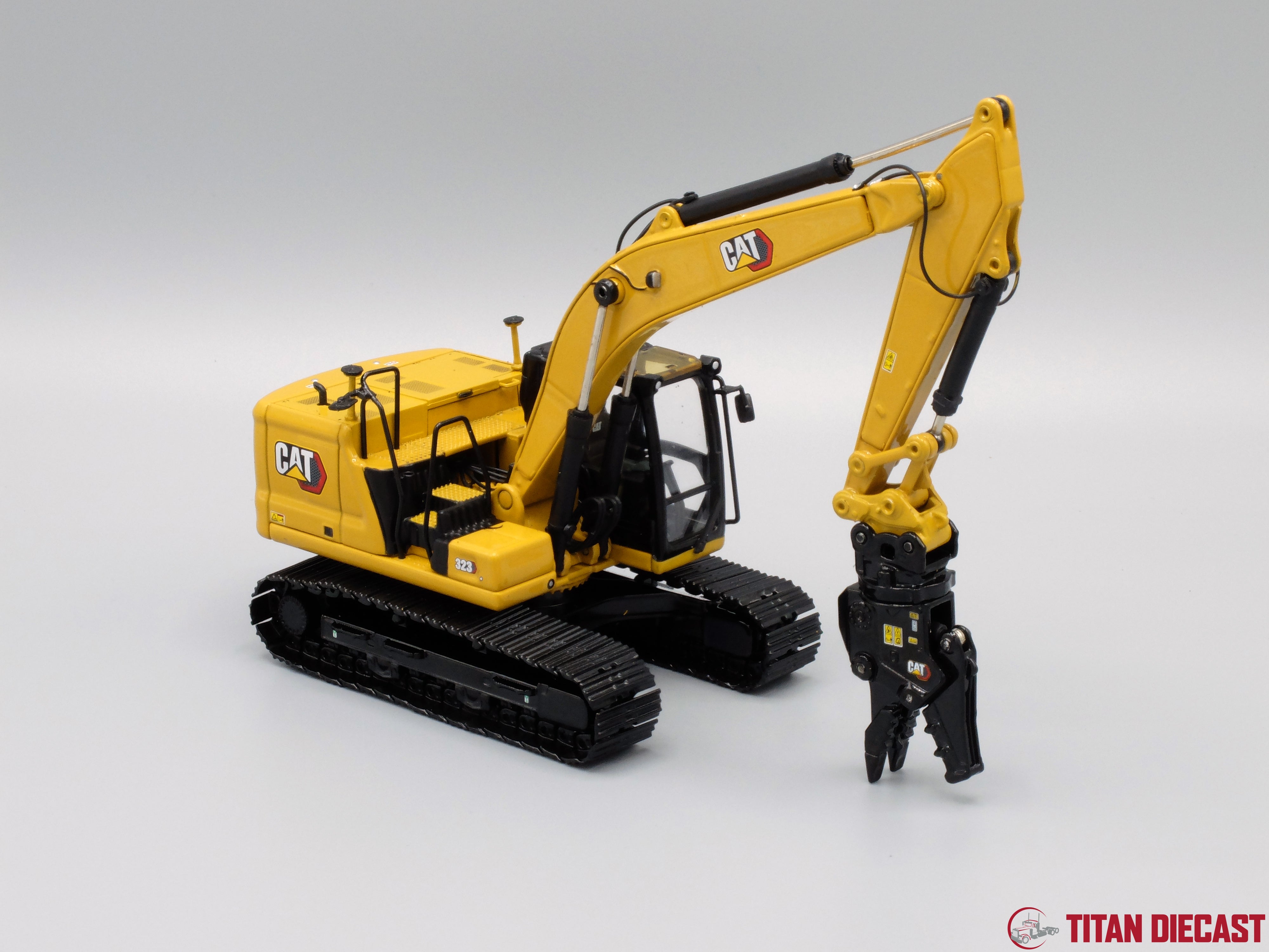 Toy excavator with sales attachments